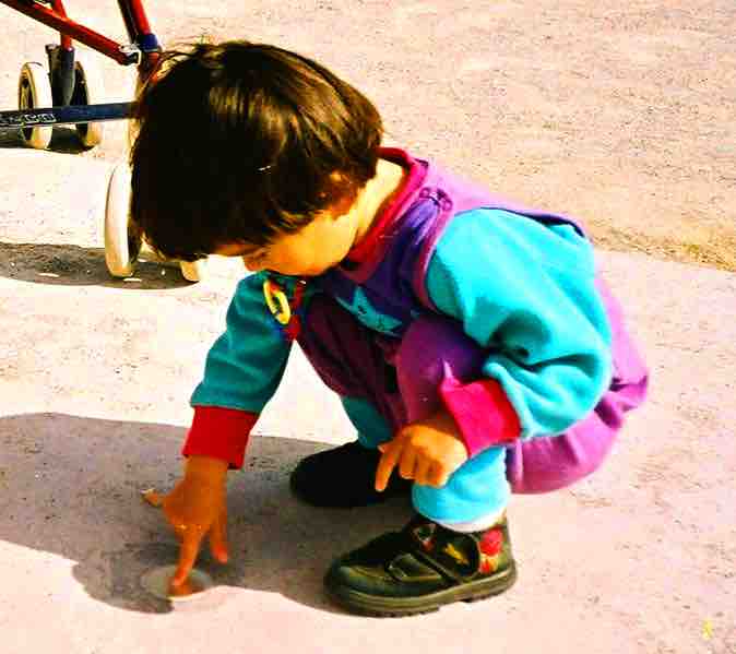 Toddler exploring her world