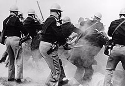 
Alabama police in 1965 attack voting rights marchers participating in the first of the Selma to Montgomery marches, which became known as "Bloody Sunday."

