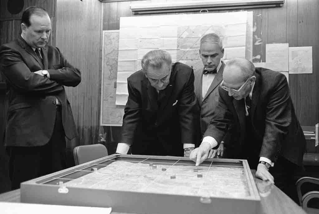 Walt Rostow shows President Lyndon B. Johnson a model of the Khe Sanh area