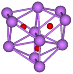 The ball-and-stick diagram shows three regular octahedra where each octahedron is connected to both of the others by one face each. All three octahedra have one edge in common. All eleven vertices of the structure are violet spheres representing caesium, and at the centre of each octahedron is a small red sphere representing oxygen.