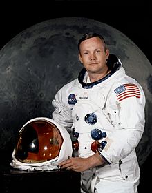 Photo of Neil Armstrong, July 1969, in space suit with the helmet off